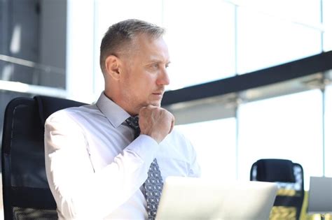 Premium Photo Mature Businessman Working On Computer In Modern Office