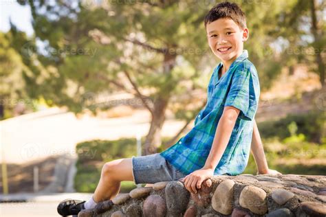 Outdoor Portrait Of A Biracial Chinese And Caucasian Boy