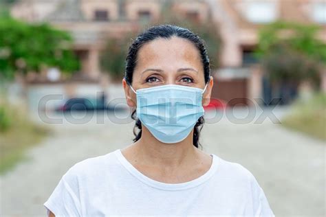 Brunette Woman Wearing A Mask Stock Image Colourbox