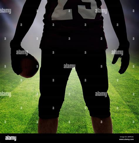 American football player silhouette on football field background Stock ...