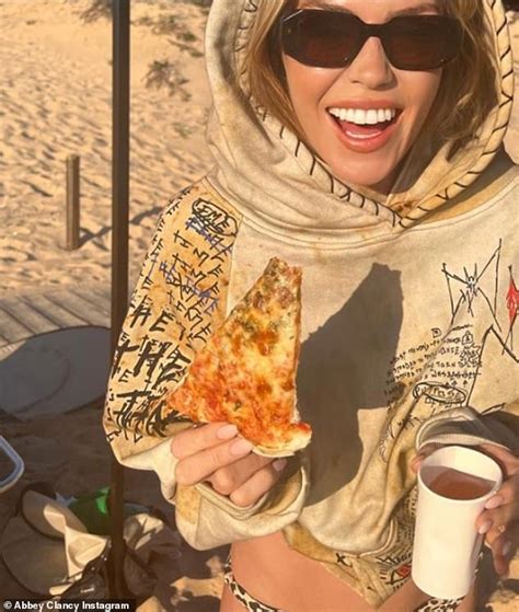 Abbey Clancy Puts On A Busty Display In A Striped Bikini Top In Sizzling Beach Shoot Snaps