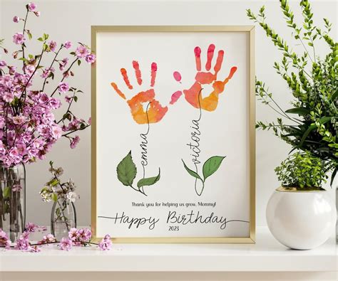 A Happy Birthday Card With Two Handprints On It And Flowers In The Vase