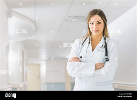 Mixed Race Doctor Smiling In Hospital Stock Photo Alamy
