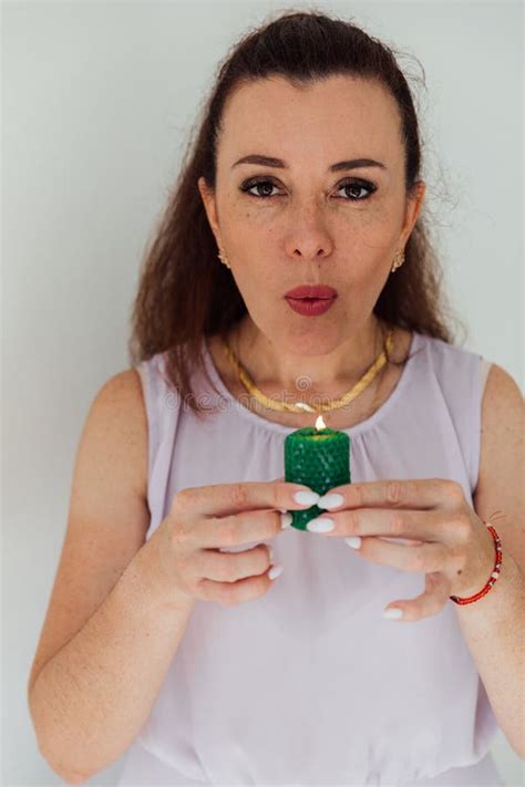 Beautiful Brunette Woman Blowing Out A Green Candle Stock Photo Image Of Candle Event 363838378