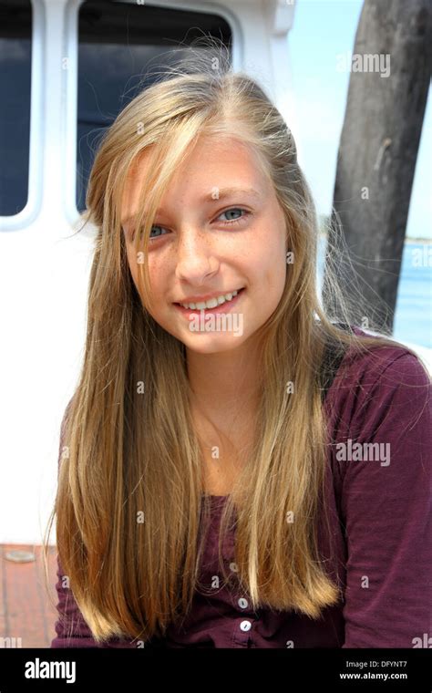 Smiling Blonde Girl On The Ship Vertical Stock Photo Alamy