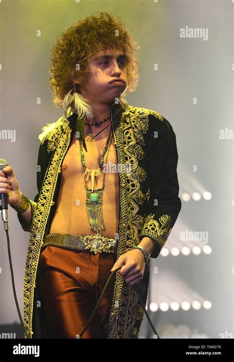 Singer Josh Kiszka Is Shown Performing On Stage During A Live Concert