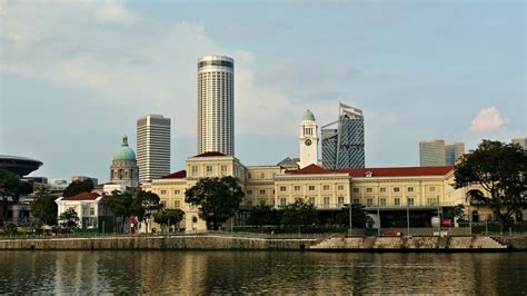 White Concrete Building Near Body Of Water Photo Free Singapur Image On Unsplash