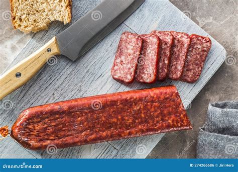 Smoked Sausage Sliced Salami On Cutting Board Top View Stock Photo