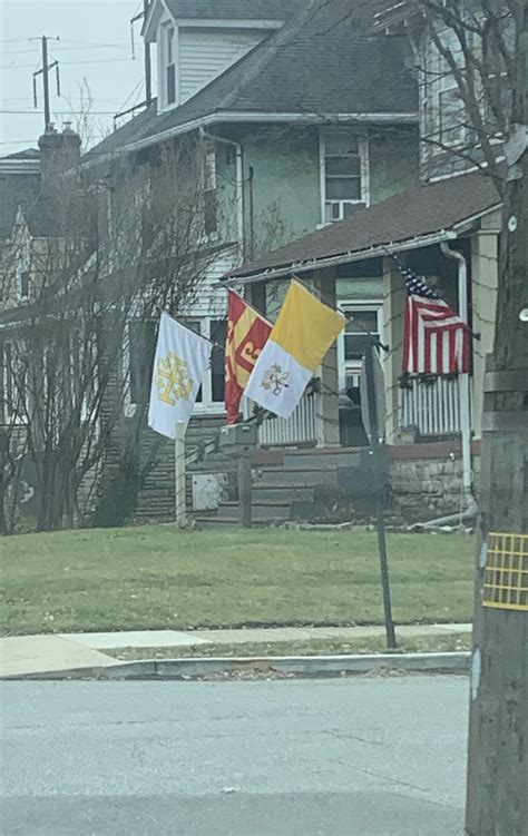 USA flag, Papal flag, and two flags representing the the Kingdom of
