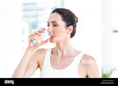 Brunette Drinking Water Stock Photo Alamy