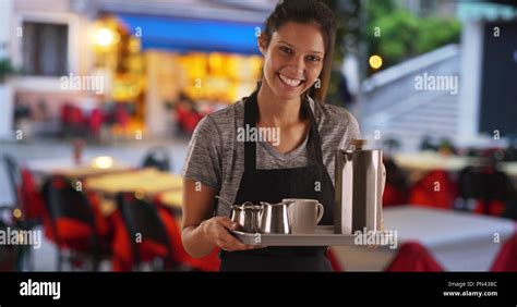 pretty waitress carrying tray  serve drinks  coffee shop