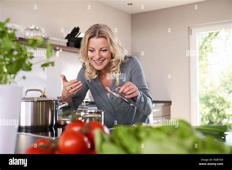 Mature Woman Cooking Kitchen High Resolution Stock Photography And Images Alamy