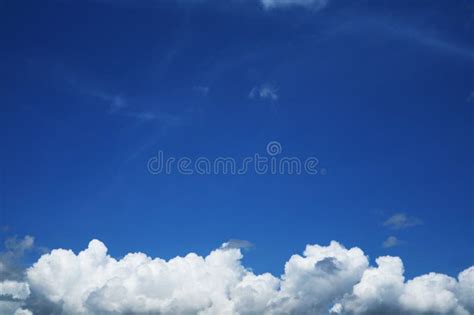 Pure Clear Blue Sky Huge White Gray Cloud And Sunlight Stock Photo