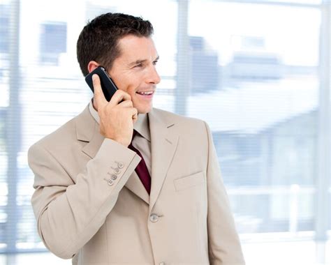 Premium Photo Charming Businessman Talking On Phone Standing