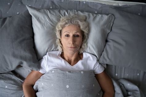 Top View Sleepless Mature Woman Lying In Bed Insomnia Concept Stock Image Image Of Anxiety