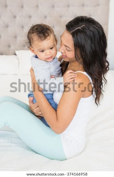 Happy Brunette Holding Her Baby On Stock Photo Shutterstock