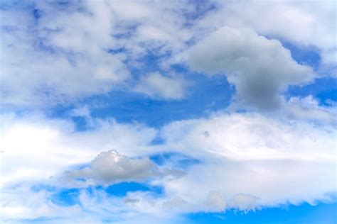 Premium Photo | Beautiful white clouds on a bright blue background