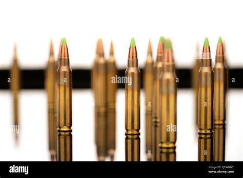 A Group Of 556 Calibar Green Tip Bullets On White Background Stock