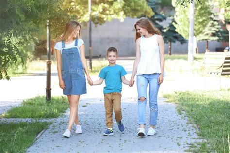Lesbian Couple With Foster Son Stock Photo Belchonock