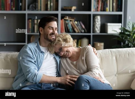 Overjoyed Mature Retired Woman Laughing At Funny Story With Son Stock Photo Alamy