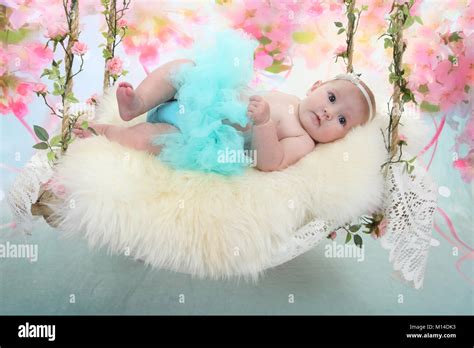 15 Week Old Baby Girl Laying Down Relaxing On Sensory Bed Stock Photo