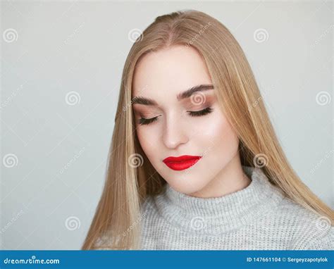 Closeup Natural Light Beauty Portrait Of Blonde Woman Model With Vibrant Saturated Red Lips