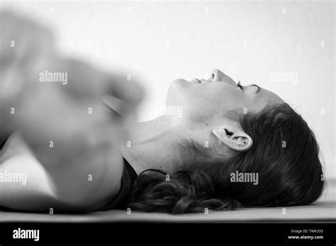 Black And White Horizontal Floor Level Close Up Of Brunette European Woman Doing Reclining