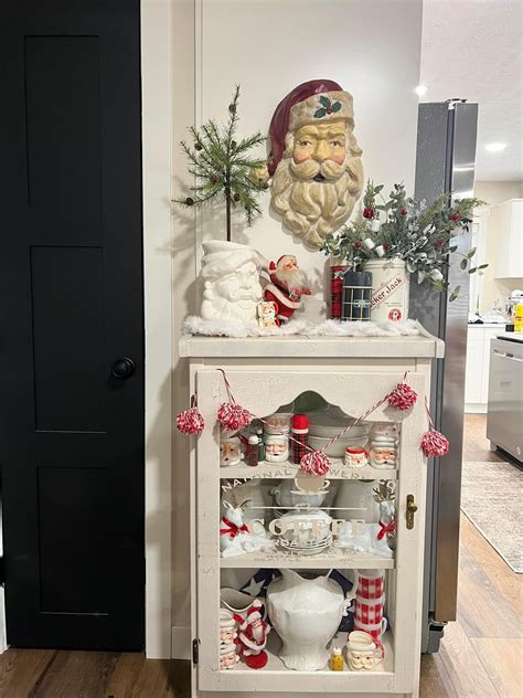 White Cabinet with Christmas Decorations