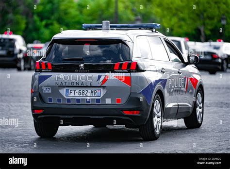 A Police Car The New Peugeot 5008 Drives Through The City Ensuring