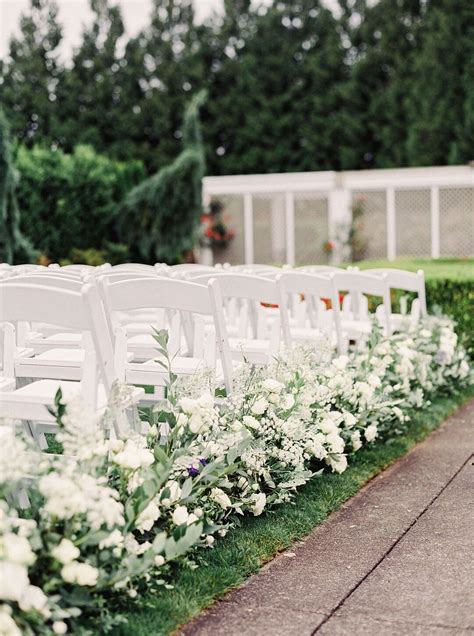 Elegant Aisle Decorations With White Flowers And Leaves