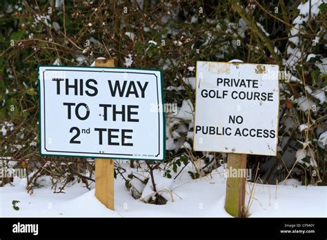 Snow Covered Golf Course With Direction Signs Suffolk England Stock