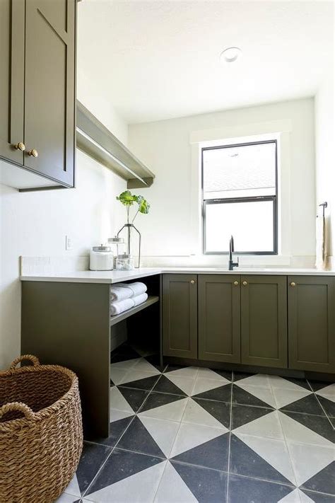 Green Laundry Room Cabinets With Black And White Harlequin Floor Tiles