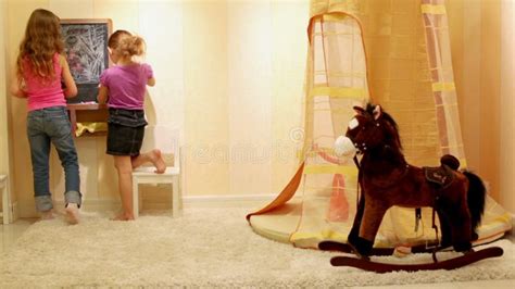 Two Girls Draw On The Chalkboard With Colored Stock Video Video Of