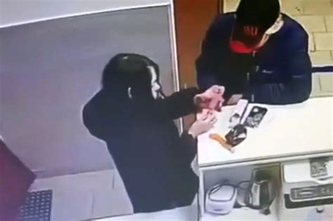 Brazen Woman Tests Out Sex Toy At Shop Counter In Front Of Horrified