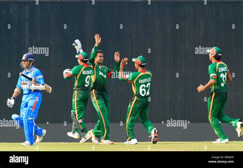 Bangladesh Cricketers Celebrate After Dismissing Indian Opening Batsman