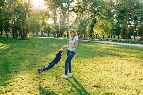 Mom play in the park with their son 7185248 Stock Photo at Vecteezy