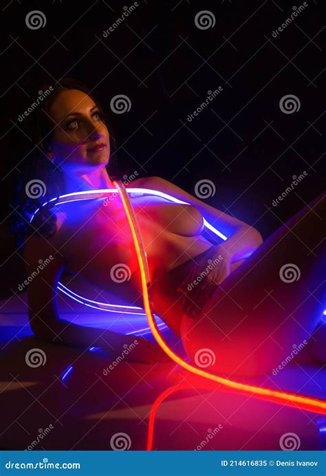 Gorgeous Nude Woman With A Beautiful Figure In The Light Of A Neon Ribbon Stock Image Image Of