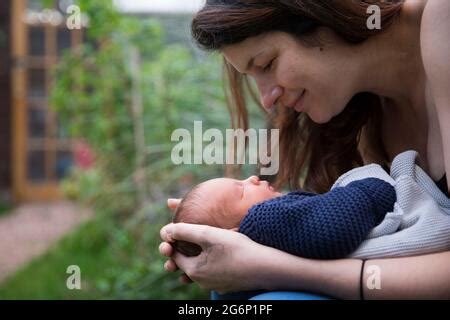 A Nude Mother Cradling Her Nude Infant Son Stock Photo Alamy