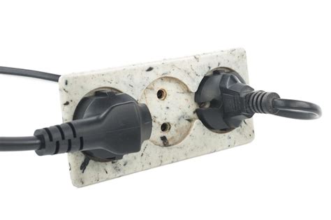 premium photo triple electrical socket  white wall   plugged