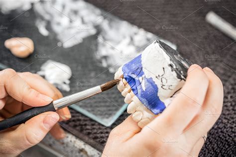 Dental technician paint | High-Quality Health Stock Photos ~ Creative ...