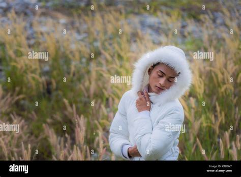 A Gay Wear Winter Clothes Walking In A Flowering Meadow In Winter The Weather Getting Cool