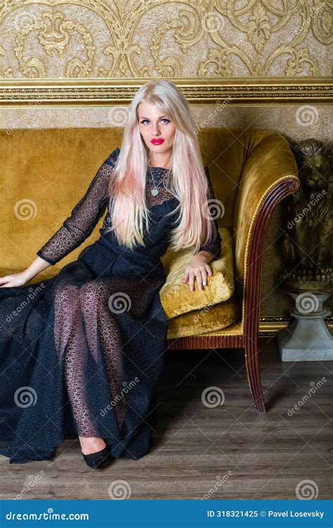Blonde In Black Lace Dress Sits On Couch With Stock Image Image Of Allurement Appeal