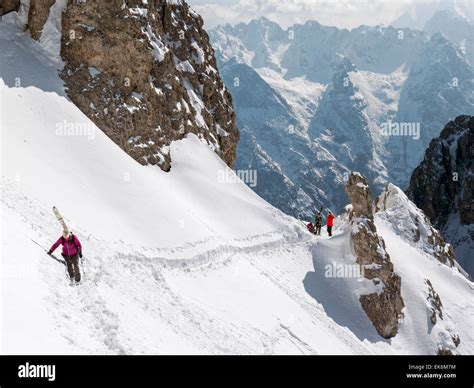 Backcountry Skiers Traversing Steep Slope Northeast Of Cortina