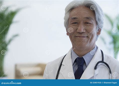 Portrait Of Mature Doctor Looking At Camera And Smiling Stock Image Image Of Expertise Focus
