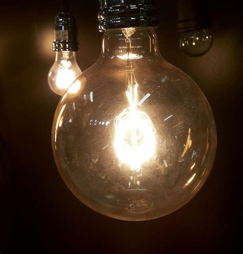 Premium Photo Close Up Of Lit Light Bulb