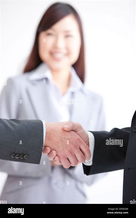 Two Businessmen Shaking Hands Stock Photo Alamy