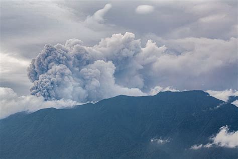 show indonesian towns covered  ash  volcano erupts newsweek
