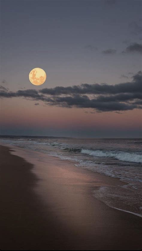 Full Moon Setting over the Ocean and Beach