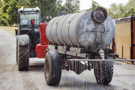 Premium Photo Water Truck Sprinkler Tank Spraying Road Against Dust