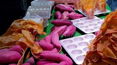 purple sweet yam slice  wooden bowl buffet man chooses sweet potato